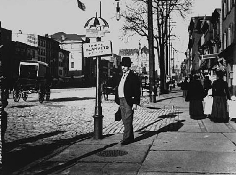 906 Broad Street
Chemist and photographer Wallace G. Levison standing on the sidewalk at 906 Broad St., next to a sign advertising horse blankets. 

Photo by Wallace G. Levison
